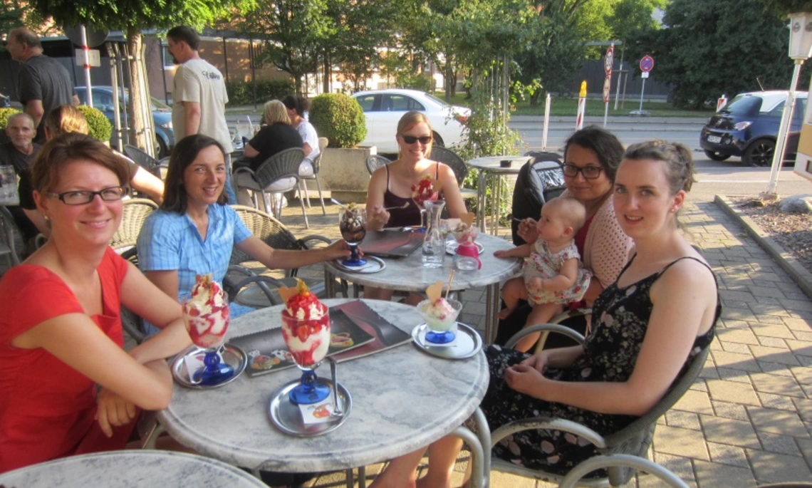 A group of female students sitting in an ice cream parlor