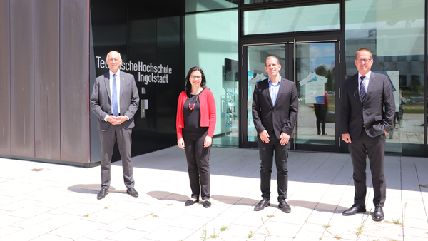 Group photo in front of the CARISSMA research and test center