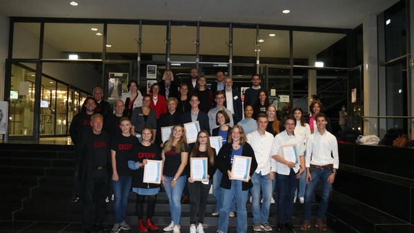 All award winners stand together for a group picture